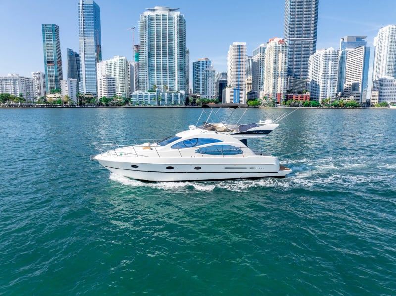 Yacht in front of the Miami skyline