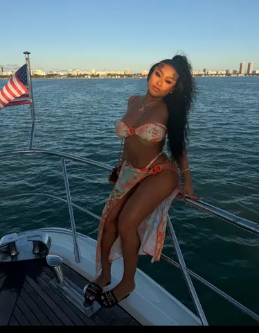 Guest on the bow with the skyline behind