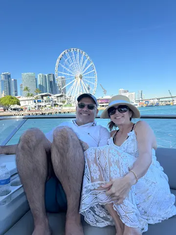 Guests on the yacht in front of the Bayside wheel